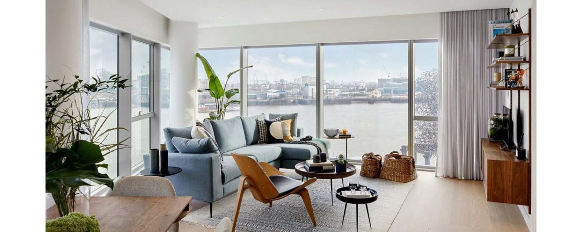 The lounge and view of the Thames at No 1 by State of Craft at Upper Riverside, Greenwich Peninsula