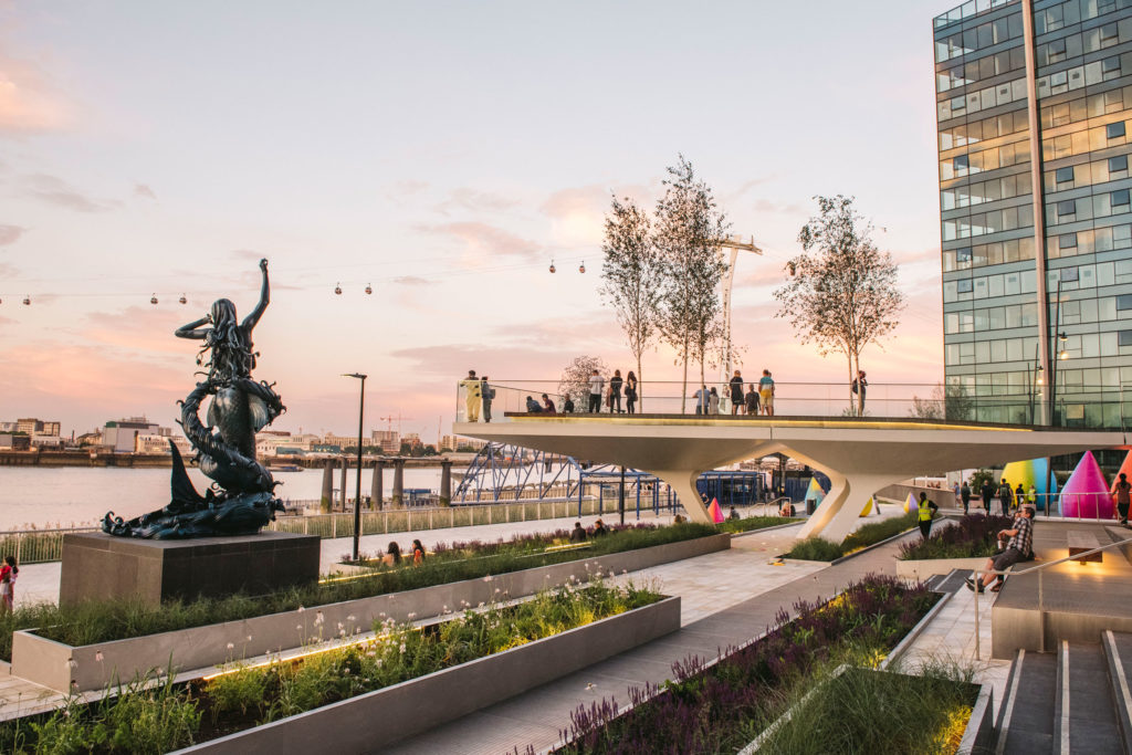 Wide image of the sunset over the boardwalk at Upper Riverside, Greenwich Peninsula